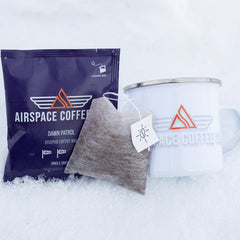 Airspace Dawn Patrol packet, coffee steeping bag and white mug