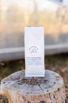 Still Good Blend package centered on an outdoor tree stump