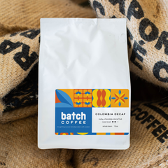 Batch Coffee Colombia Decaf bag resting on patterned burlap