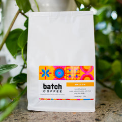 Batch Mellow low-caffeine blend in a white coffee bag
