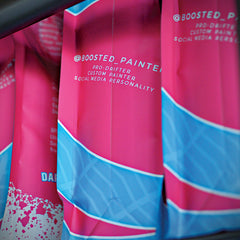 Close-up of pink and turquoise package artwork