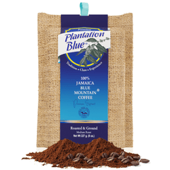 Plantation Blue 8 oz medium ground Jamaica Blue Mountain coffee bag with a pile of ground coffee in front