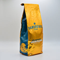 Gold Daredevil Decaf House Blend bag at an angle