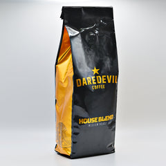 Angled black-and-gold Daredevil House Blend bag