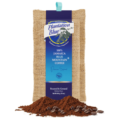 Plantation Blue 16 oz medium ground Jamaica Blue Mountain coffee bag with a pile of ground coffee in front