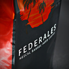 Federales name and mezcal-barrel label detail