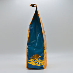 Side view of the gold-and-blue decaf package
