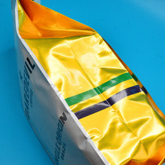 Close view of metallic gold Brazil bag side panel