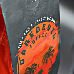 Close-up of orange Daredevil skull emblem