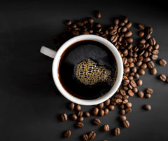 Black coffee cup and beans pictured with the roast bundle