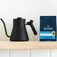 Colombian Inspiration bag beside a black gooseneck kettle