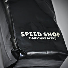 Close view of Speed Shop lettering on bag front