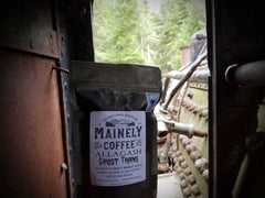 Mainely Allagash Ghost Trains pouch inside a weathered metal compartment