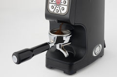 Eureka Atom 75 coffee chute and portafilter fork