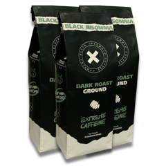 Three bags of Black Insomnia Dark Roast ground coffee