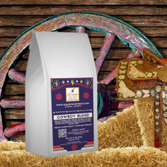 White Cowboy Blend bag posed in front of a wooden wagon wheel — Al Gusto Cowboy Blend Medium-Dark Coffee