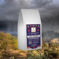 White Dark Monsoon bag against a cloudy desert landscape — Al Gusto Dark Monsoon Dark Roast Coffee Blend