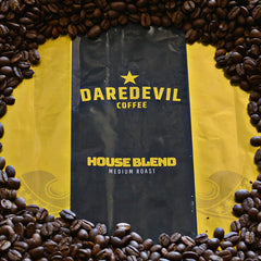House Blend package surrounded by roasted beans