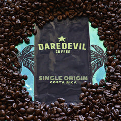 Daredevil Costa Rica package surrounded by roasted beans