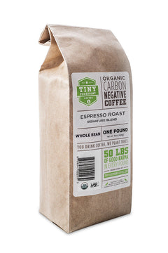Brown Tiny Footprint Espresso bag with a white-and-green label — Tiny Footprint Signature Espresso Medium Roast Coffee