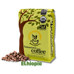 Tomorrow’s Coffee bag beside lighter-roasted whole beans — Tomorrow’s Coffee Ethiopian Organic Coffee gallery