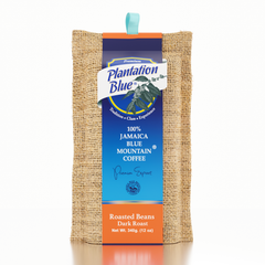Plantation Blue 12 oz dark whole-bean Jamaica Blue Mountain coffee in burlap packaging with a tall blue label