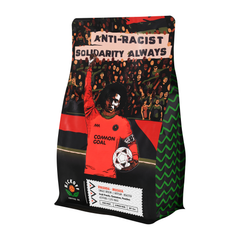 Solidarity Always bag with a soccer player and Anti-Racist banner — Kickoff Solidarity Always Rwanda Coffee