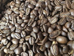 Close-up of coffee beans shown with RedEye India coffee