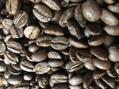 Close-up of coffee beans shown with RedEye Espresso Blend
