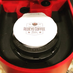 RedEye Coffee Roasters logo on a round white sticker