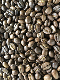 Close-up of green coffee beans shown with RedEye Sumatra coffee