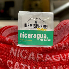 Close view of a Nicaragua Red Catuai bag and printed sack — Hemisphere Nicaragua Red Catuai Light Roast, 10 oz