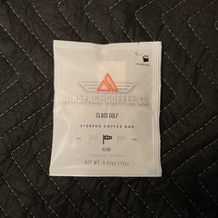Airspace Class Golf medium-roast coffee packet on dark fabric