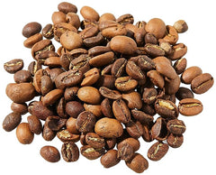 Light-brown roasted coffee beans shown loose in the Tèt āndi Laye gallery