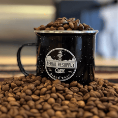 Aerial Resupply mug filled with coffee beans for MOAB