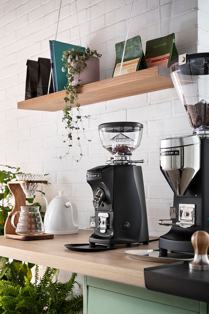Black Mazzer Mini On Demand with short hopper on a kitchen countertop