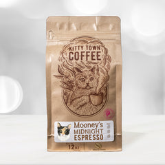 Kitty Town Mooney’s Midnight Dark Espresso Coffee — 12 oz coffee bag standing on a kitchen counter