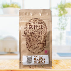 Kitty Town Nadia Jamaican Me Crazy Flavored Coffee — 12 oz coffee bag standing on a kitchen counter