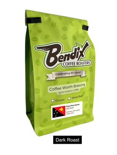 Front of green Bendix Papua New Guinea Dark Roast Coffee bag showing its product label
