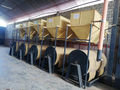 Row of mechanical coffee dryers inside a processing building