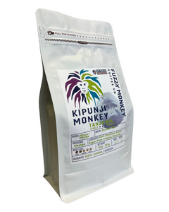 Fuzzy Monkey Kipunji Tanzania Light Roast Coffee — white Kipunji Monkey Tanzania pouch with purple-and-green artwork