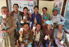 Women posing together indoors with coffee cups — Myanmar Myin Dwin Natural Coffee, 5 lb gallery