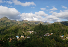 Green mountain landscape beneath a blue sky and white clouds — Myanmar Myin Dwin Natural Coffee, 12 oz gallery