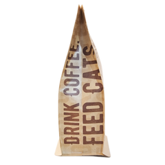 Kitty Town Delilah’s Brazilian Dark Roast Decaf Coffee — side of the kraft pouch with Drink Coffee Feed Cats lettering