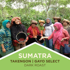 Group of women holding containers beneath a Sumatra Takengon banner — Tiny Footprint Sumatra Takengon Select Dark Roast