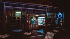 Illuminated café exterior photographed at night — Clear Lake Surf Medium Roast Coffee Blend gallery