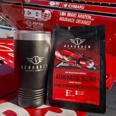 Aerobrew tumbler and Aerobatic Blend bag beside aircraft markings