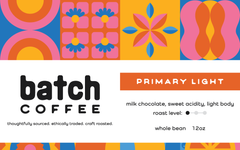 Primary Light label listing milk chocolate, sweet acidity and light body