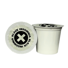 Two Black Insomnia Classic Roast pods showing lid and side