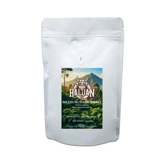 Haluan Bali Blue coffee in a white pouch with landscape artwork